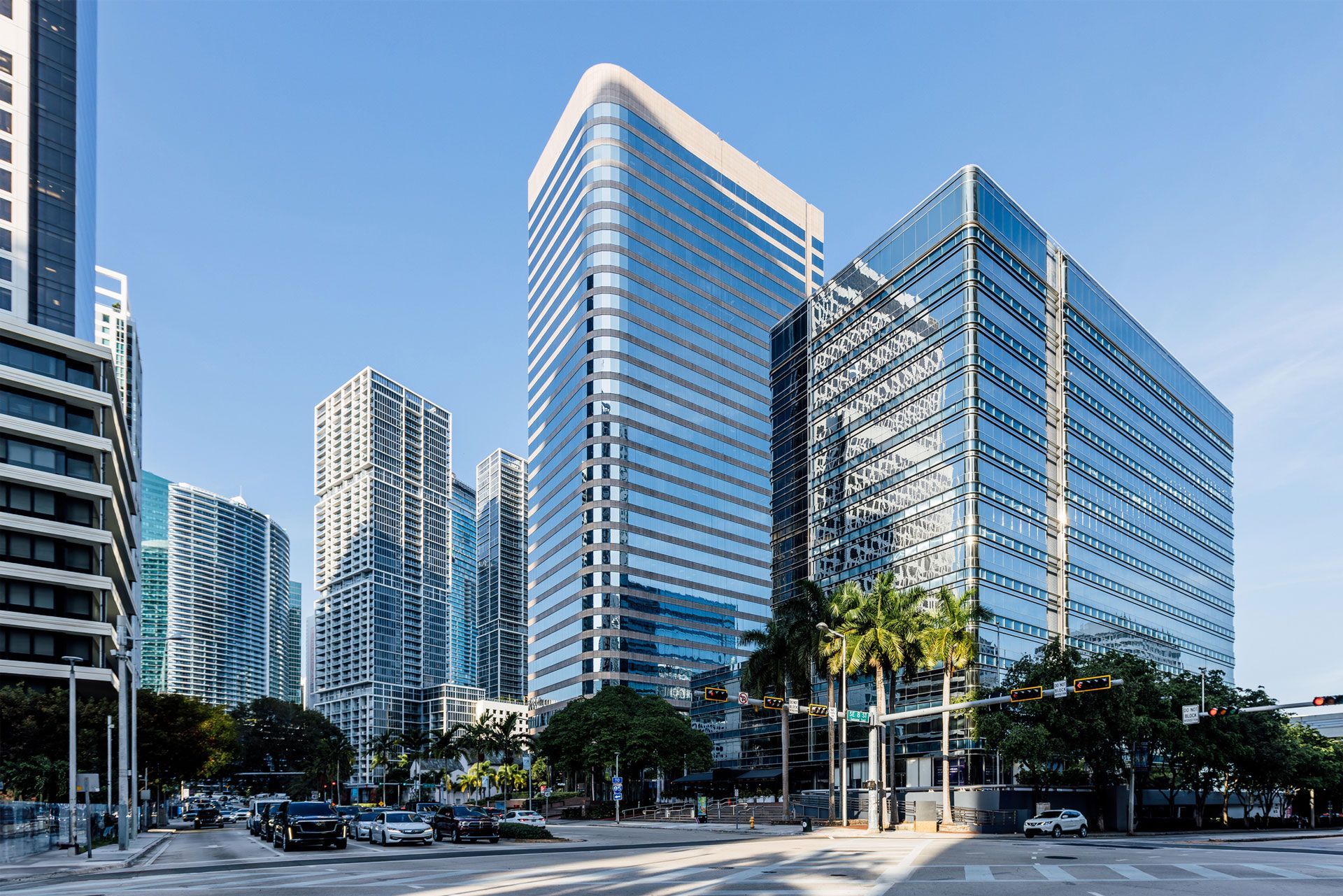 A group of tall buildings are sitting next to each other in a city.