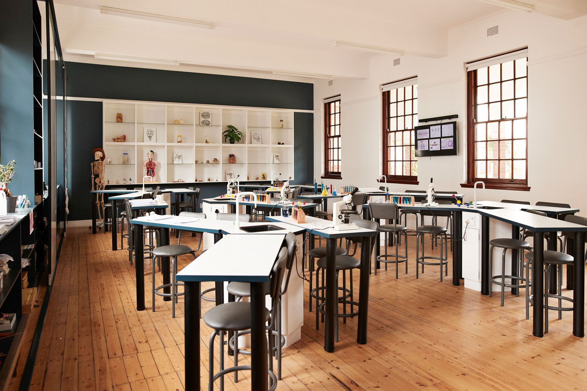 A large classroom with lots of tables and chairs