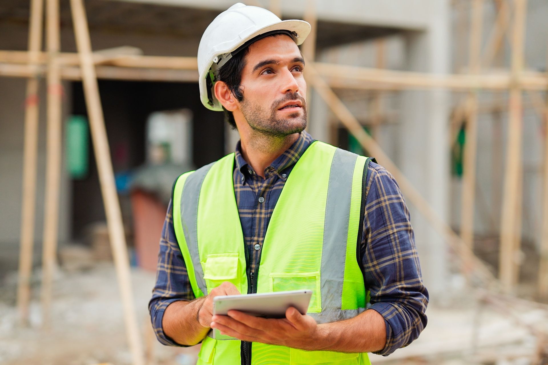 Construction Worker Holding a Tablet