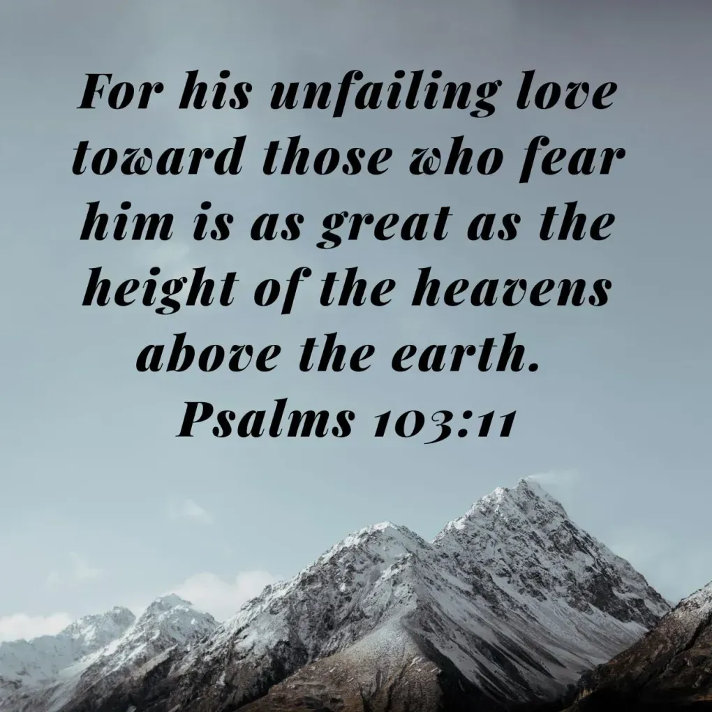A quote from psalms 103 11 with mountains in the background