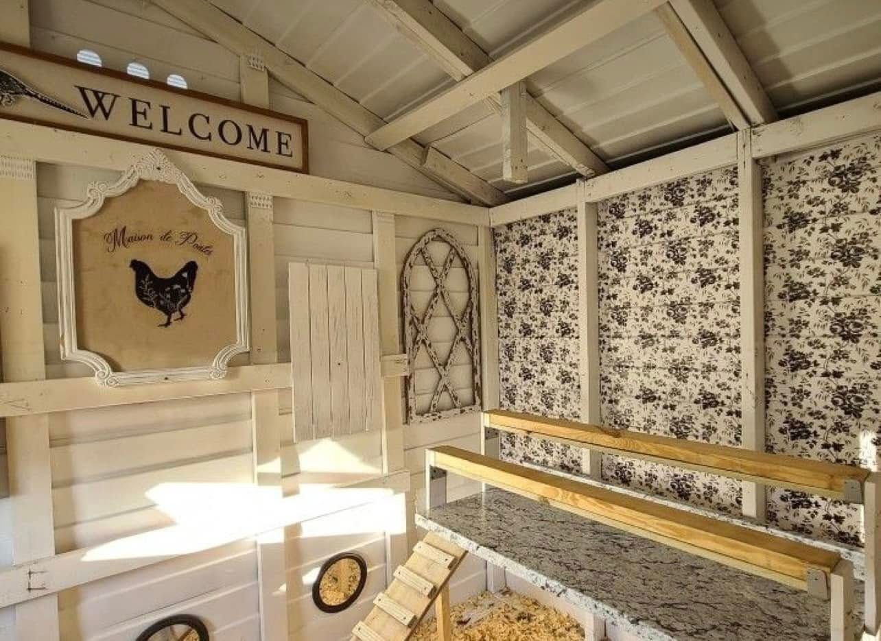 Rustic indoor stairwell with a “WELCOME” sign, butterfly wall art, and patterned wallpaper
