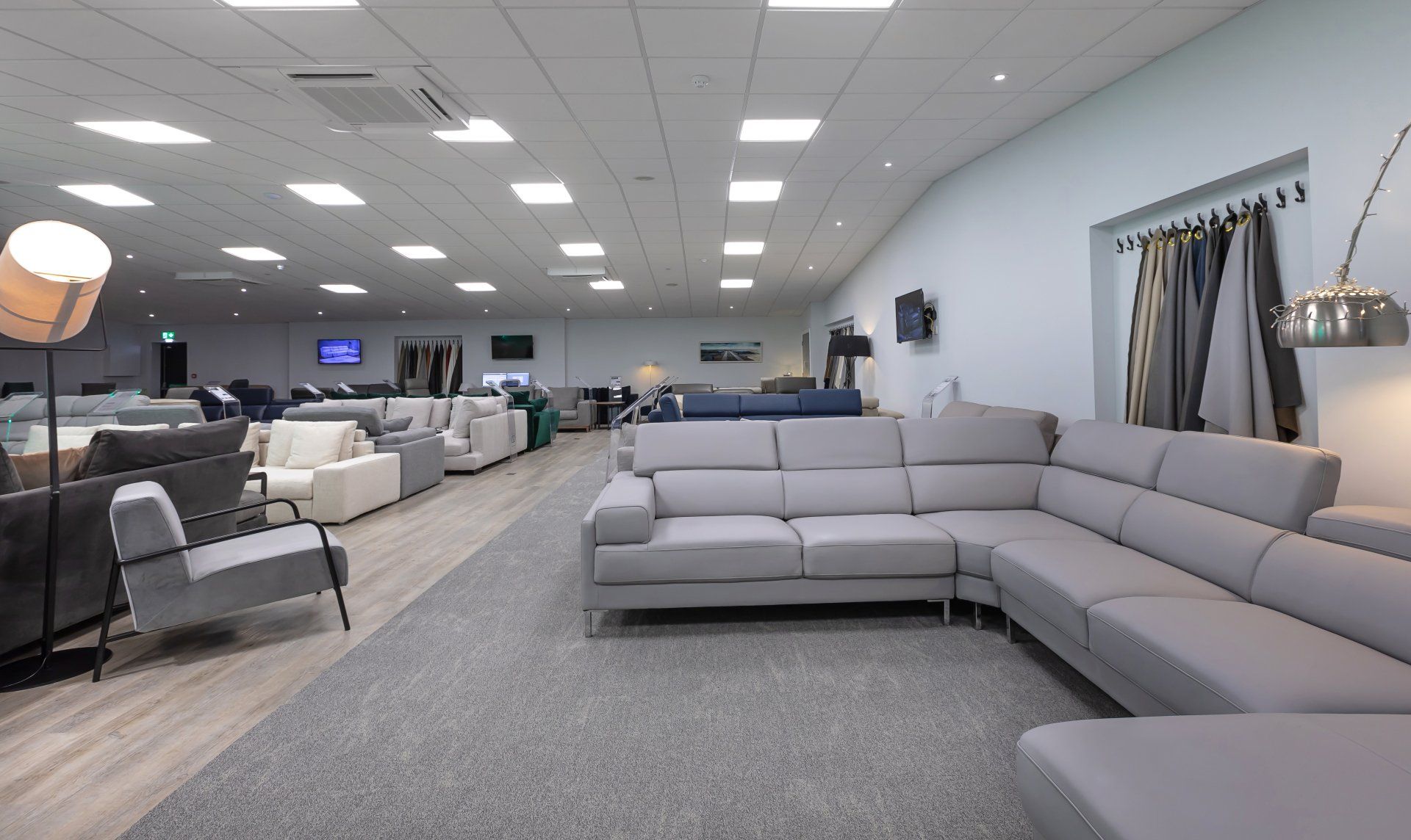 A large room filled with furniture and a couch.