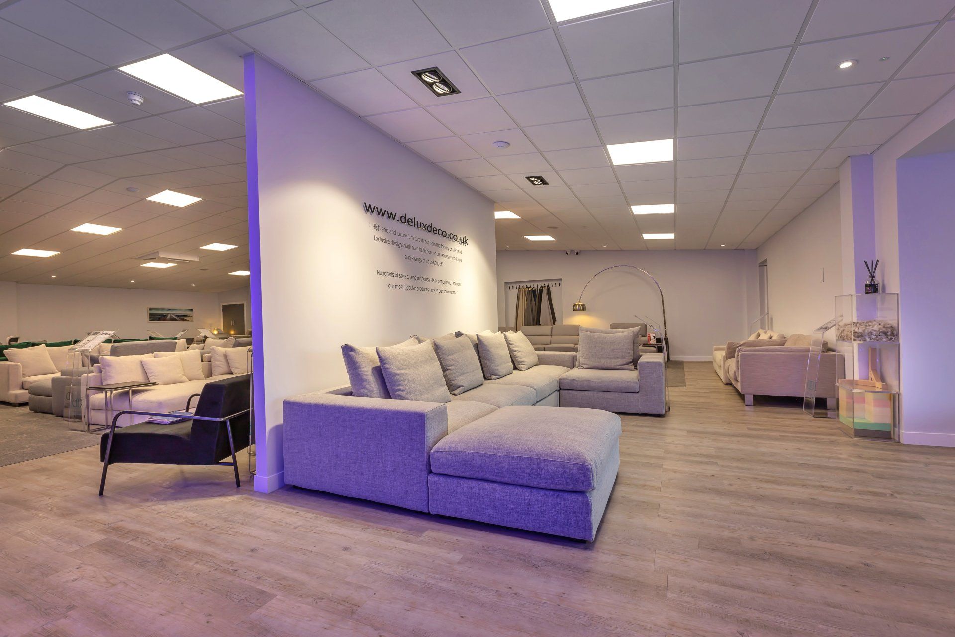 A living room filled with furniture and a large sectional couch.