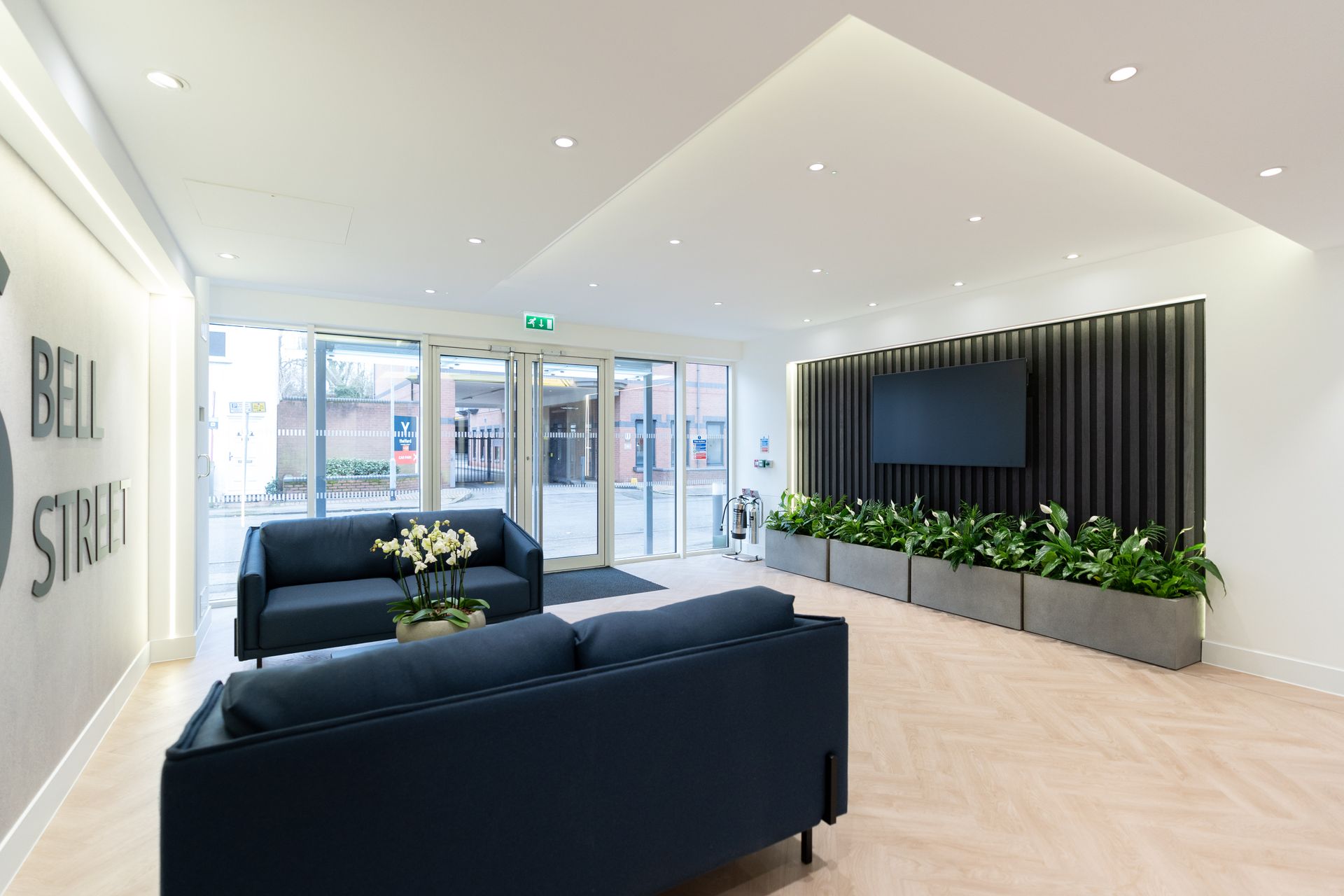 A room with a bed, chairs, lamps and a wall that says `` experience weightlessness ''. Specialist nursing care beds