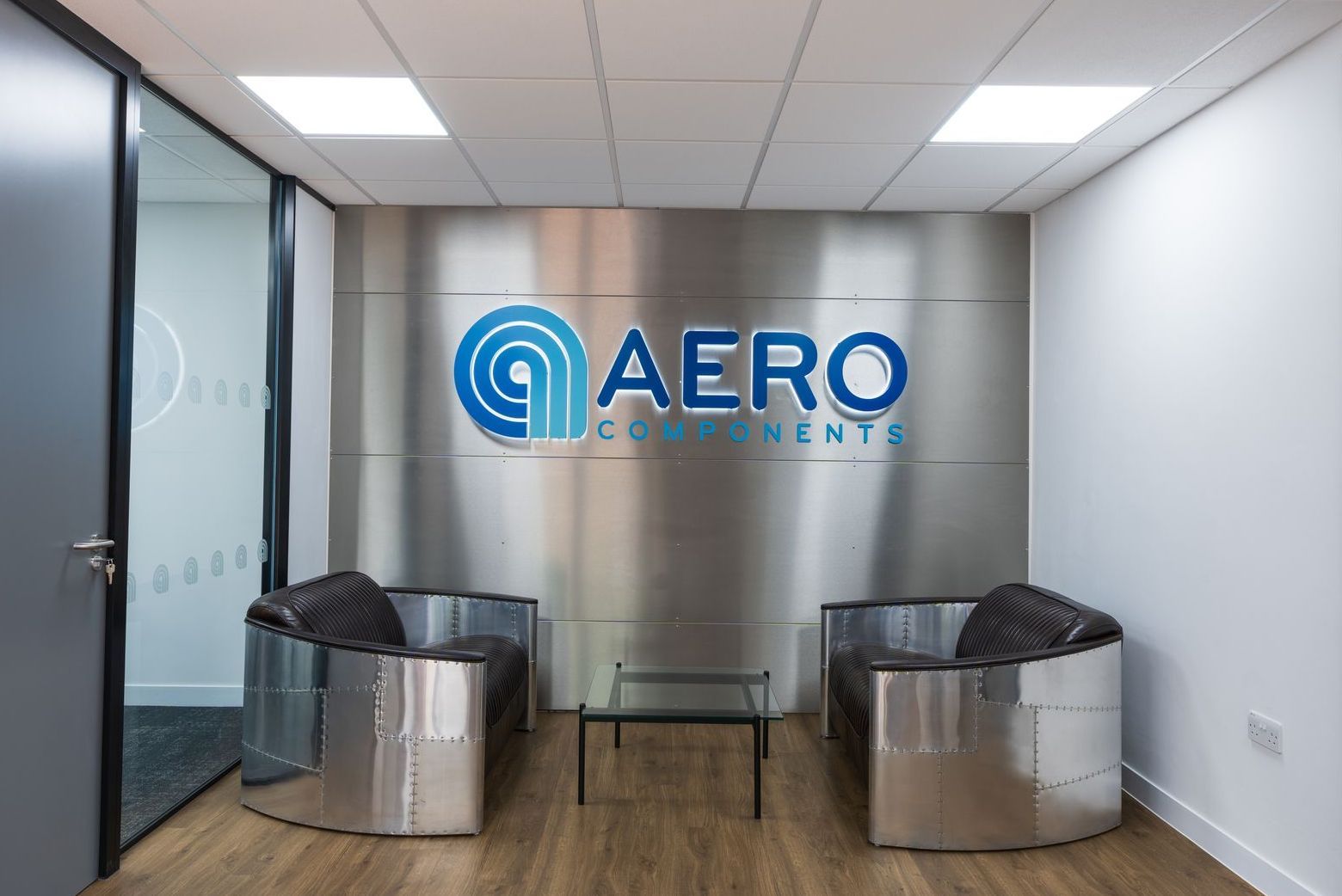 Waiting area of a precision engineering facility with two custom made chairs