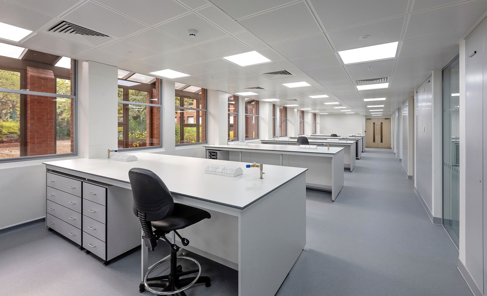 A large office with a lot of desks and chairs
