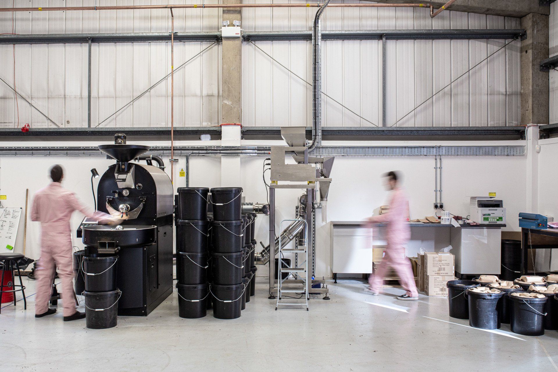 Employees working in a light industrial space by Glenside