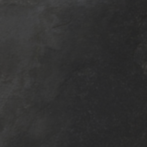 a close up of a black chalkboard texture .
