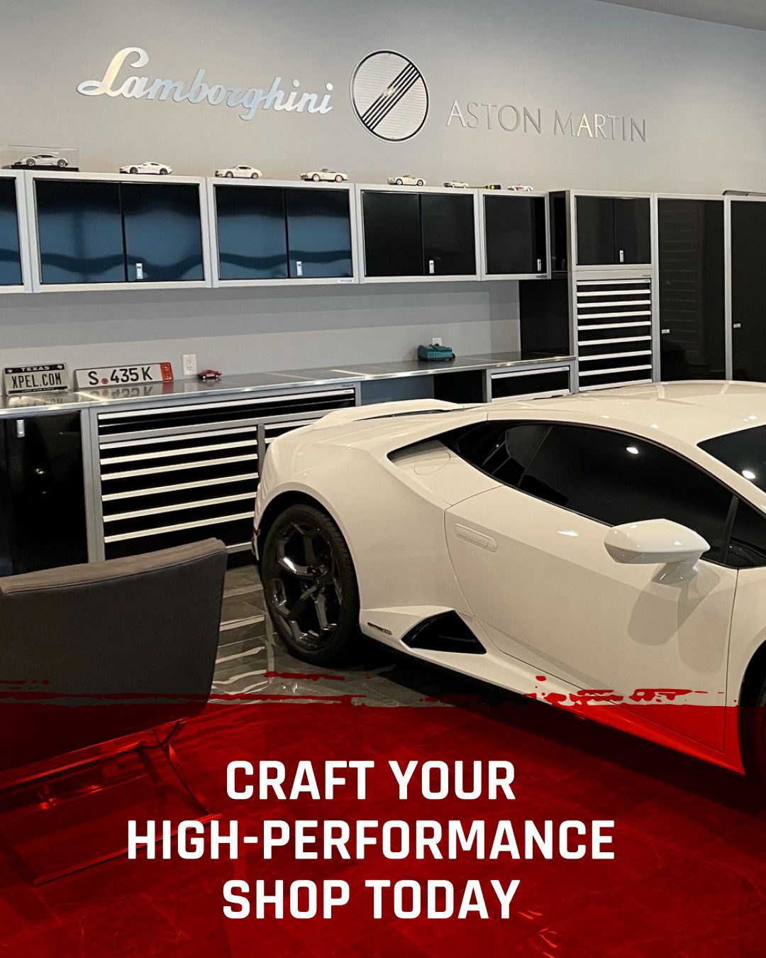 A white Lamborghini parked in a luxury garage with black cabinets and branded signage, promoting a high-performance shop.