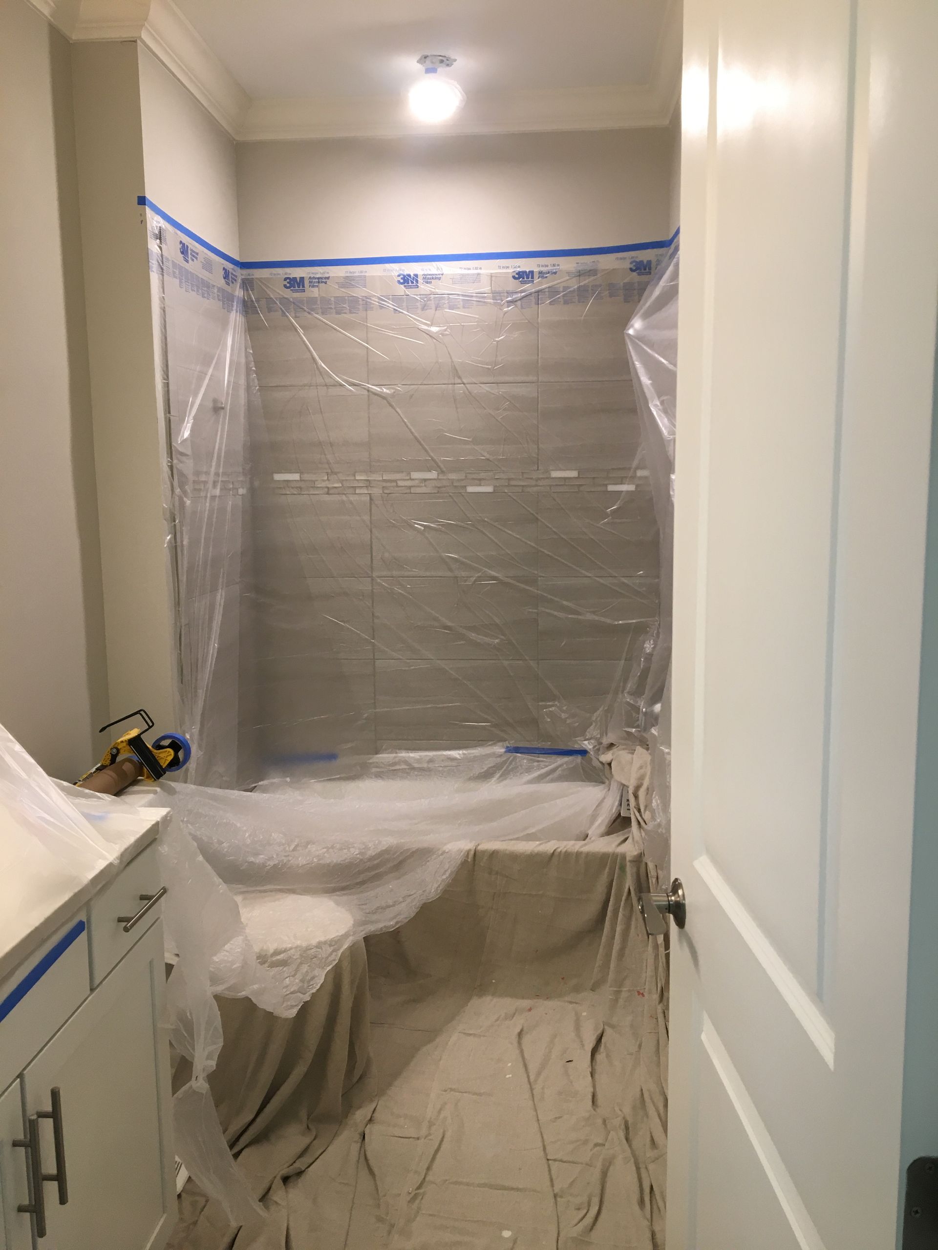 Bathroom wrapped in protective plastic sheeting for deep cleaning services or move in and move out cleaning.