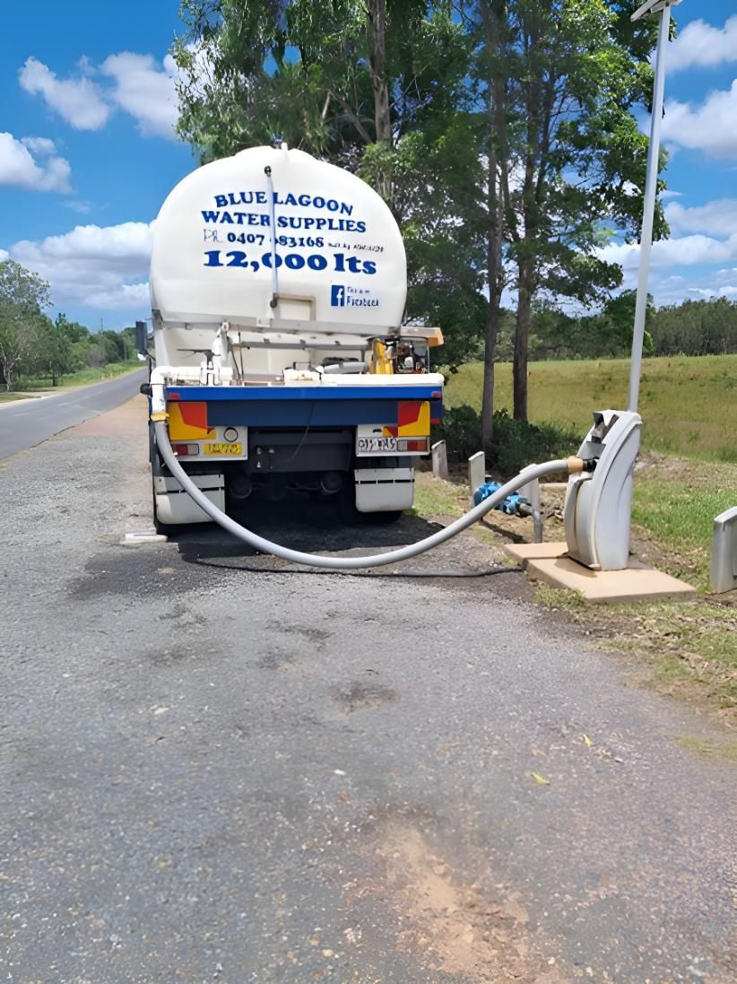 A Water Truck Is Parked On The Side Of The Road — Blue Lagoon Water Supplies In Urangan, QLD