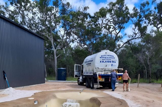 A Large Truck Is Parked Next To A Swimming Pool — Blue Lagoon Water Supplies In Urangan, QLD