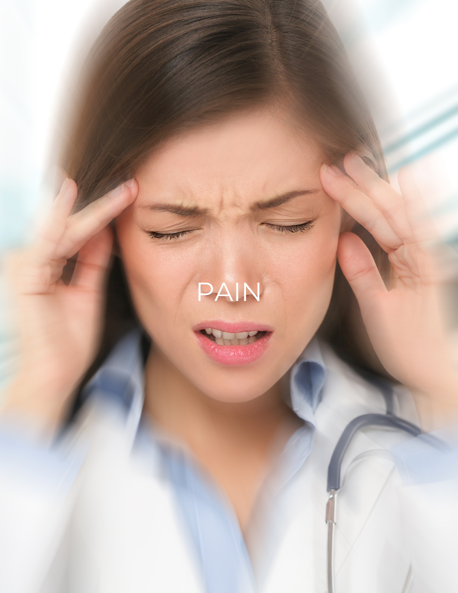 Woman holding her temples in pain, with eyes closed and a blurred stethoscope around her neck.
