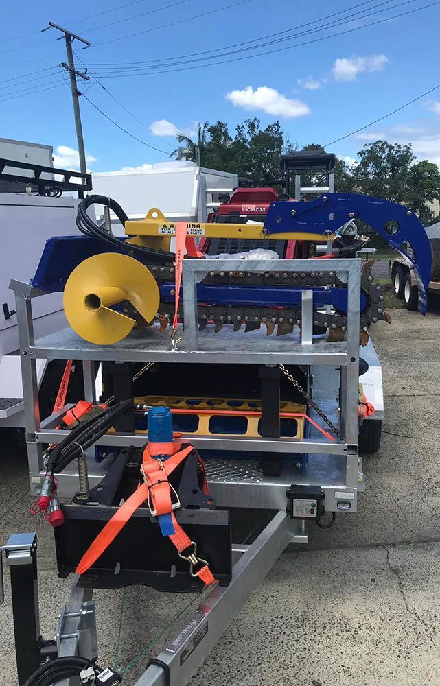 A Trailer With a Machine on It is Parked in a Parking Lot — S & S Tiling and Rendering in Dubbo, NSW