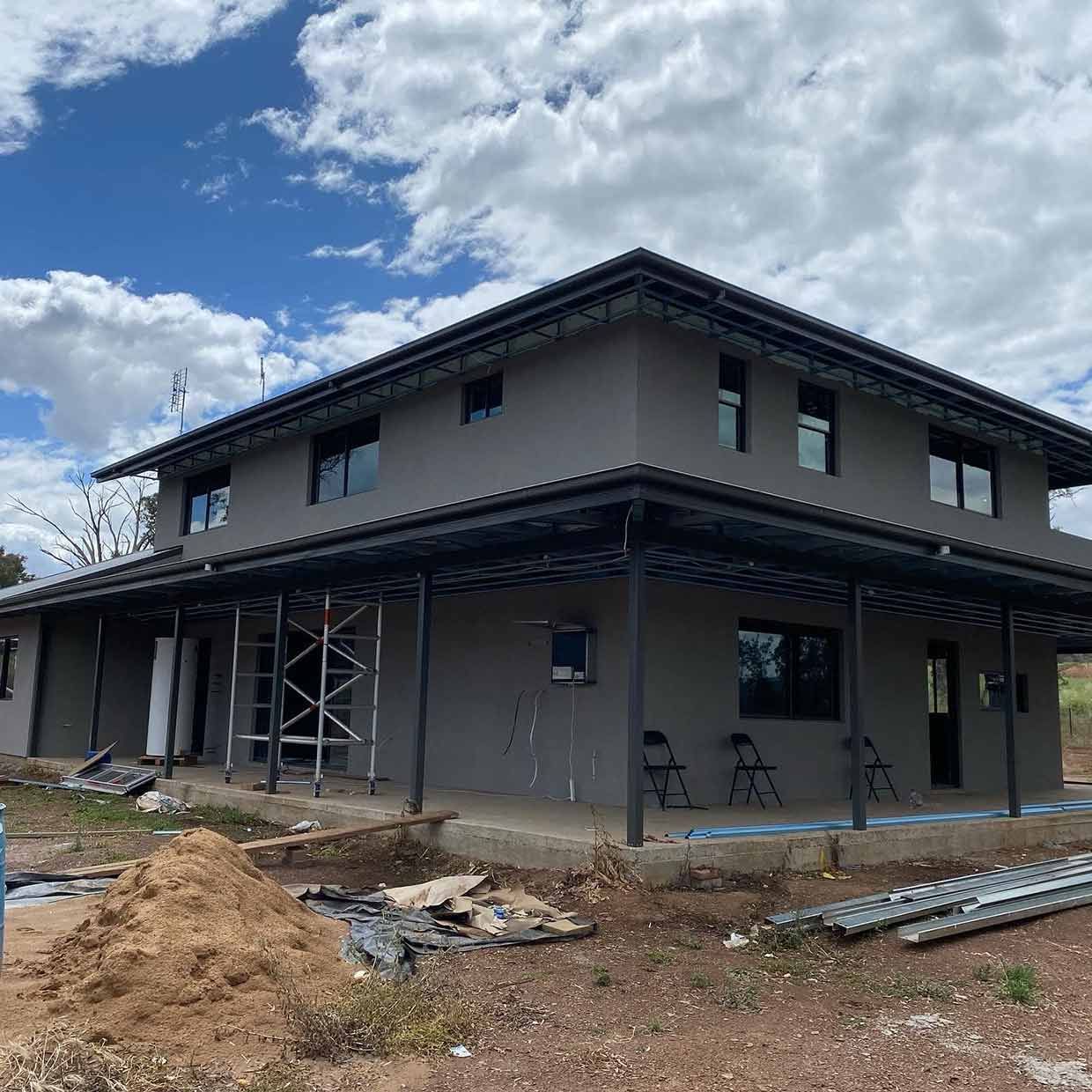 A Large House is Being Built in the Middle of a Dirt Field — S & S Tiling and Rendering in Cobar, NSW