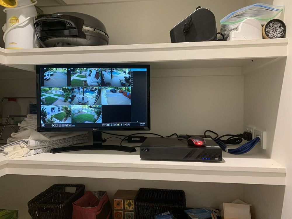 A Computer Monitor Is Sitting on Top of A Shelf in A Room — T.N. Locke Communications In Kirwan, QLD