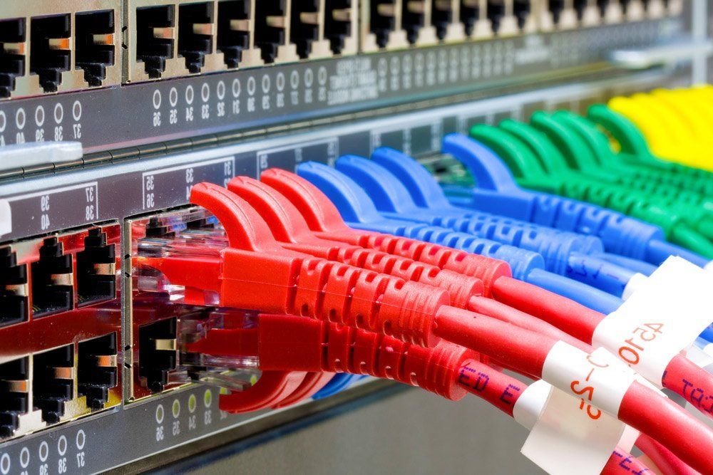A Bunch of Colored Wires Are Connected to A Server — T.N. Locke Communications In Kirwan, QLD