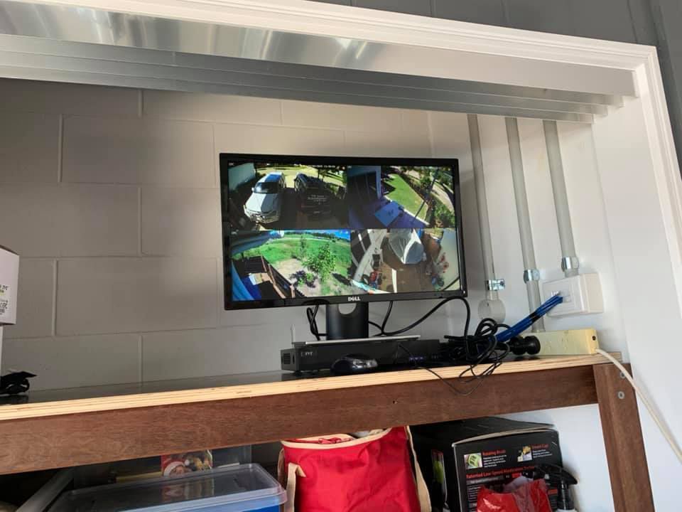 A Computer Monitor Is Sitting on Top of A Wooden Table — T.N. Locke Communications In Kirwan, QLD