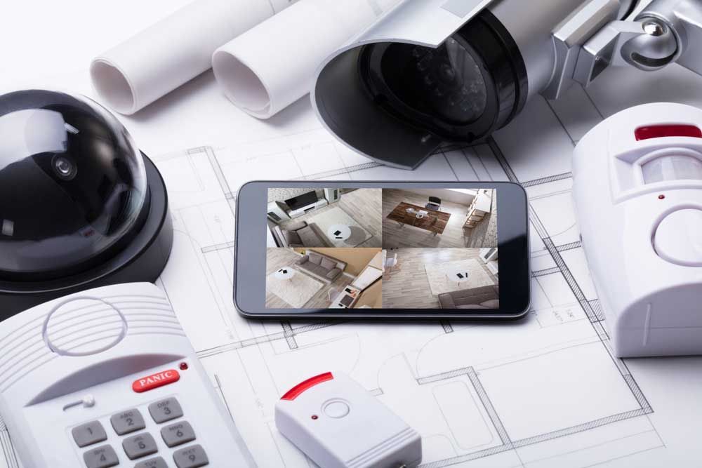 A Security System Is Sitting on Top of A Blueprint — T.N. Locke Communications In Kirwan, QLD