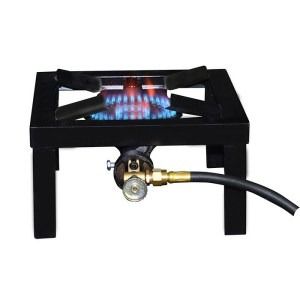 A small gas stove with a hose attached to it.