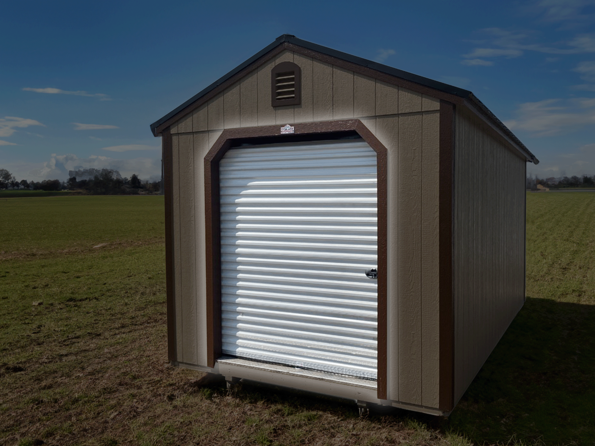 A shed with a white door is sitting in the middle of a field.