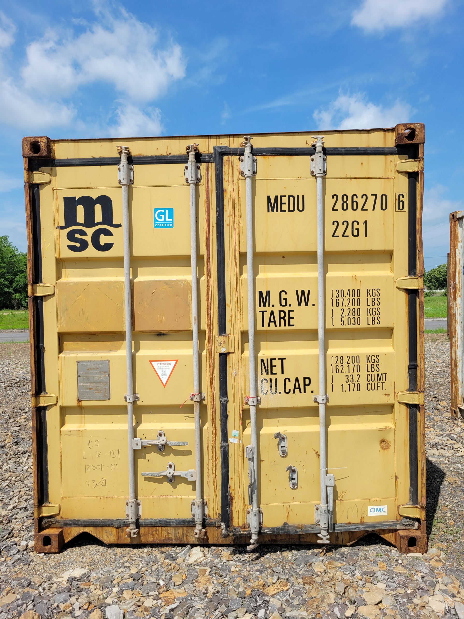 A yellow shipping container that says medu on it