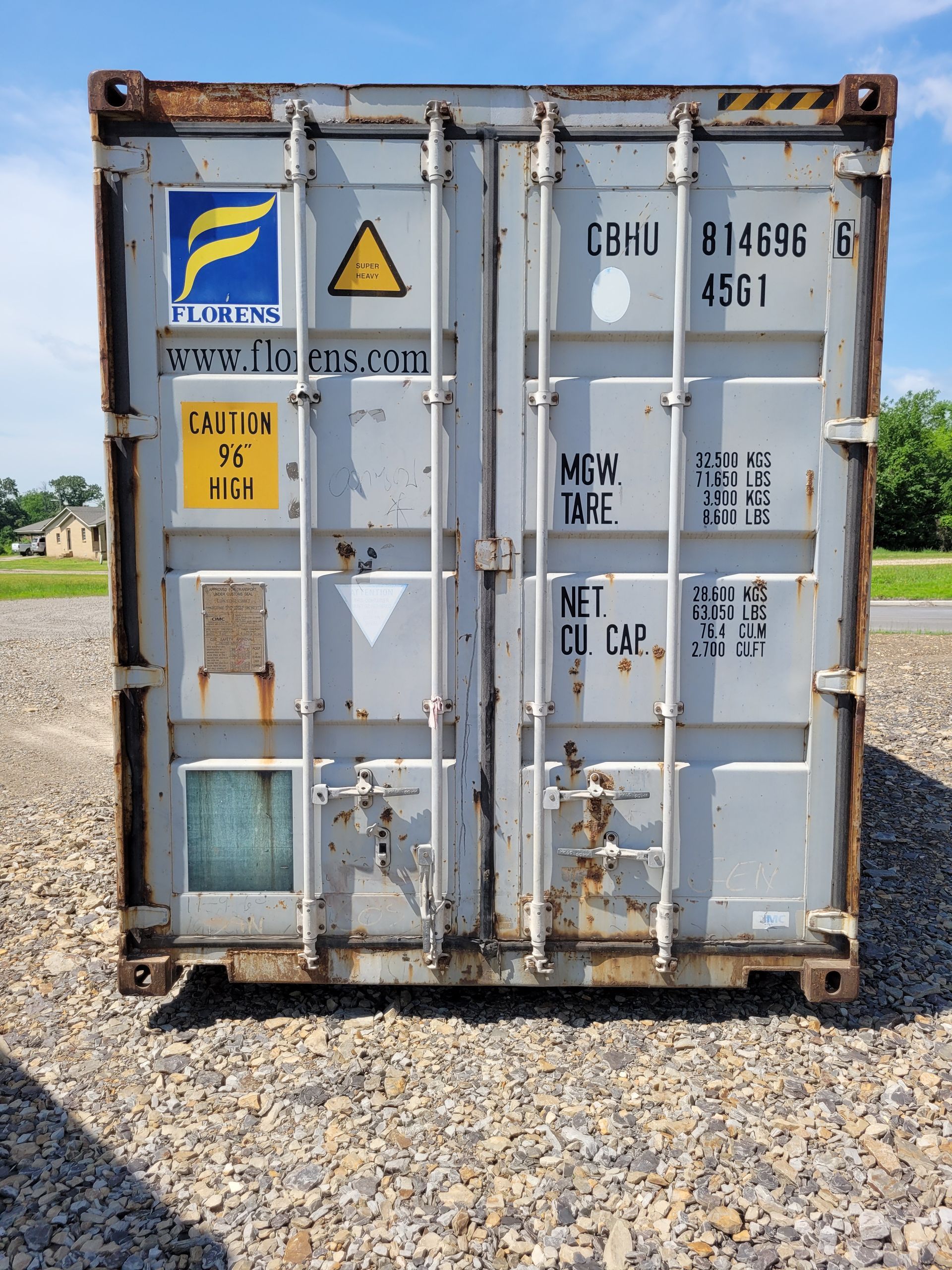 A shipping container with a blue f on it