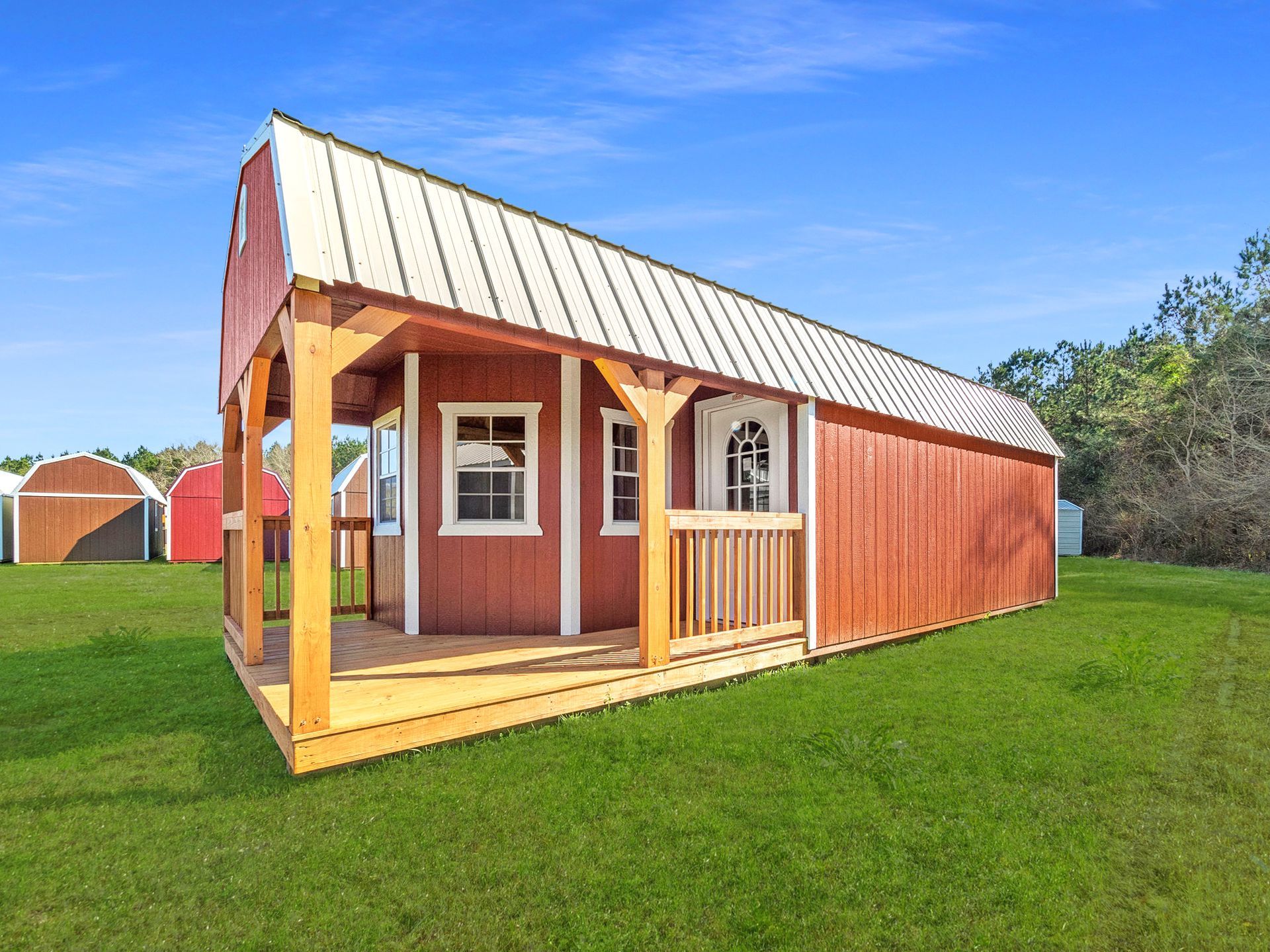 Superior Outdoor Centers  Tiny houses A small wooden house with a black roof and a window.