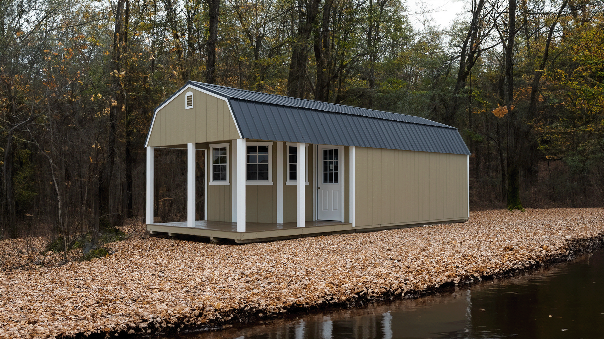 Superior Outdoor Centers deluxe lofted barn cabin A small house with a porch is sitting next to a body of water.