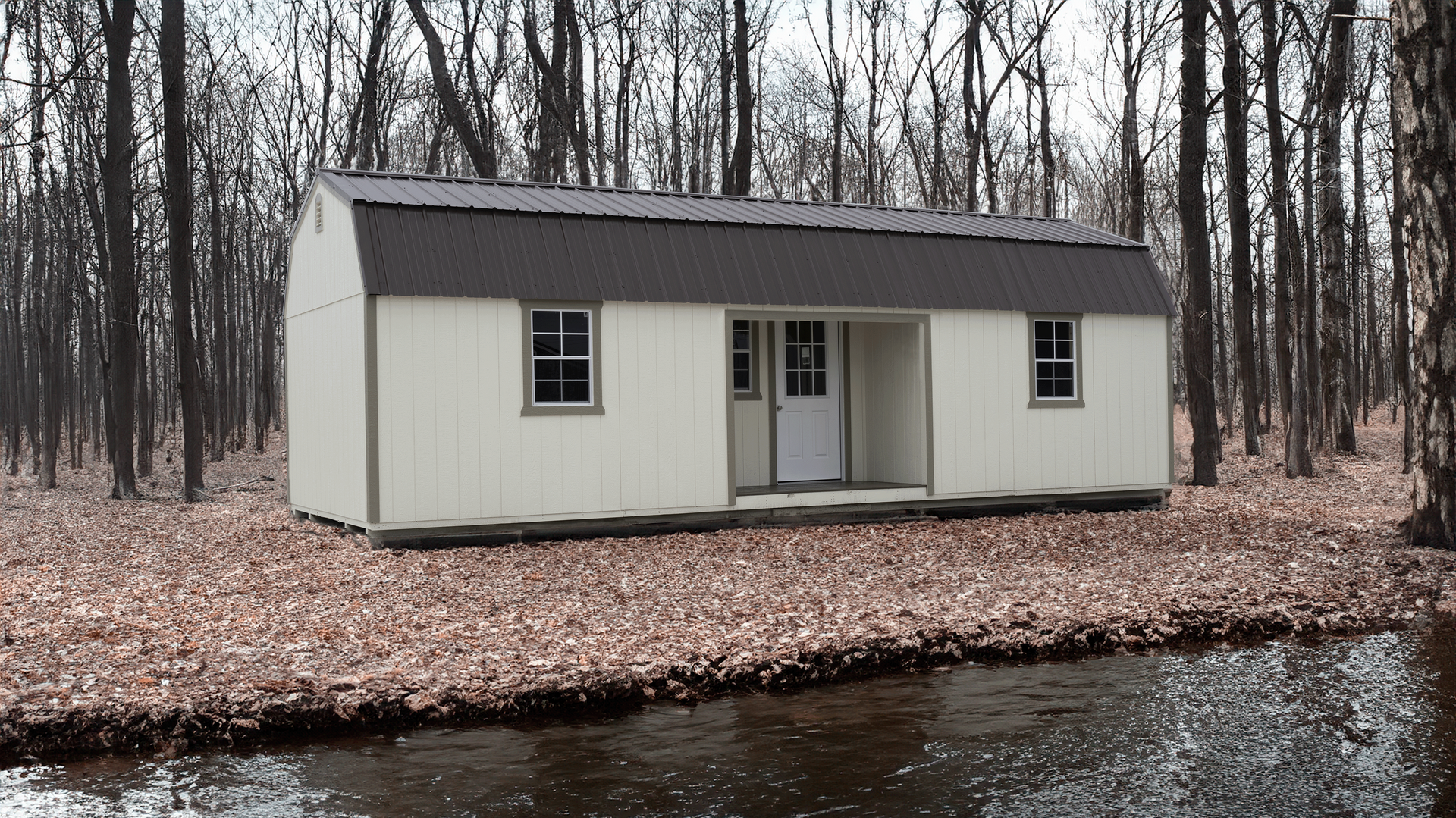 Superior Outdoor Centers  center lofted cabin A small white house in the middle of a forest next to a body of water
