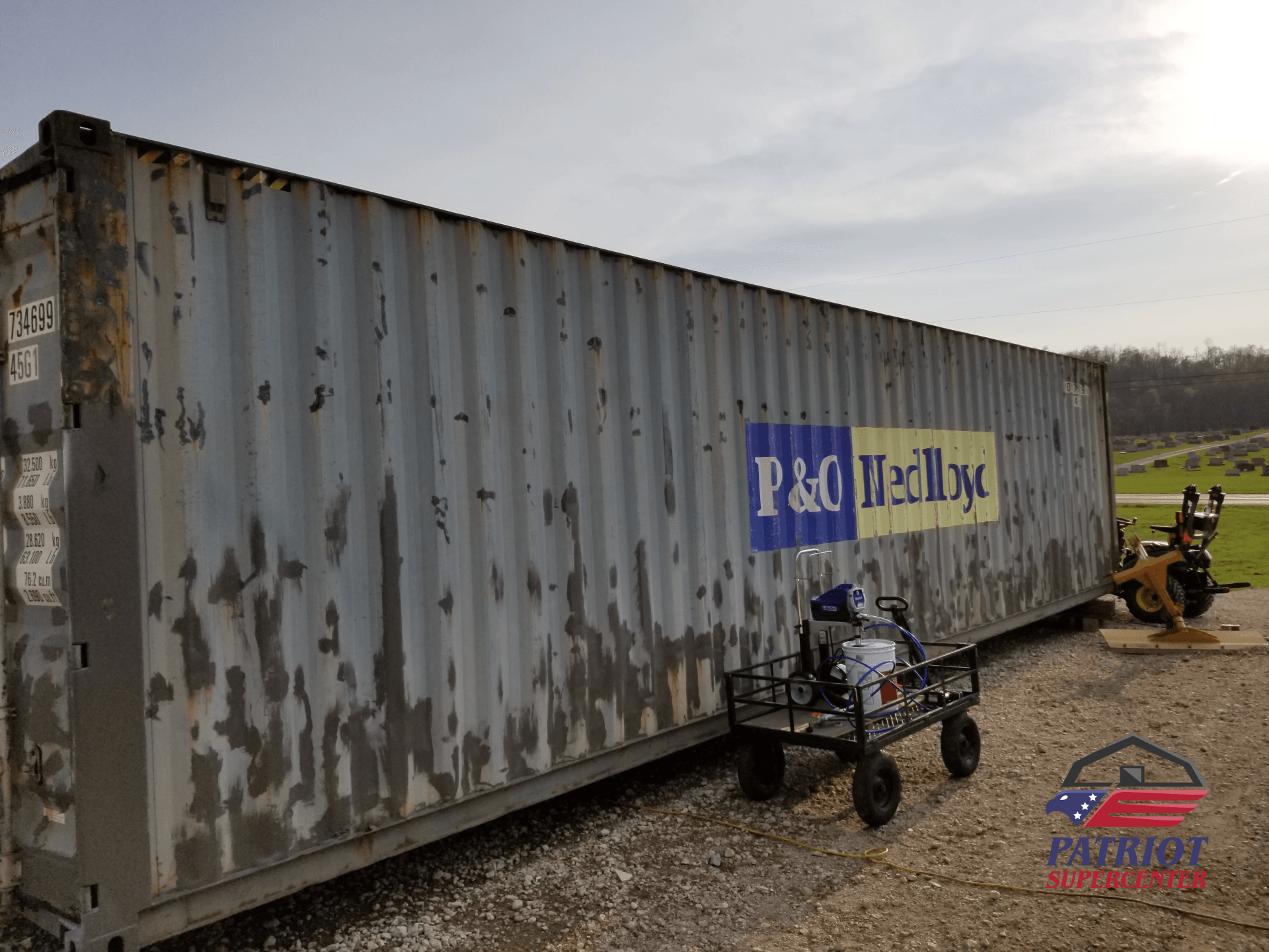 A large shipping container with the word p & q on it