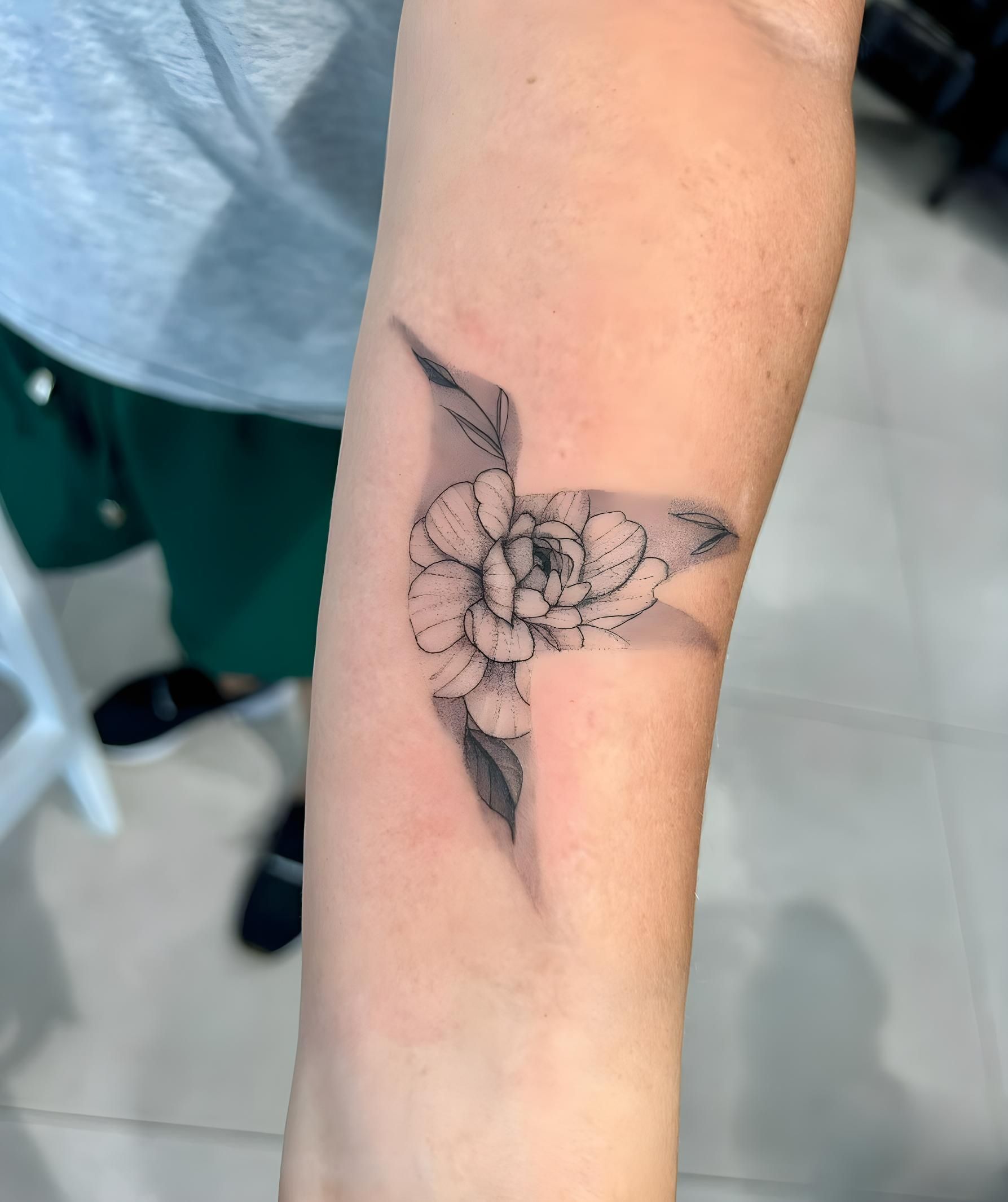 Tattoo Of A Black And White Flower And Leaves On A Person's Forearm — Tattoo Inc Studio In Broadbeach, QLD