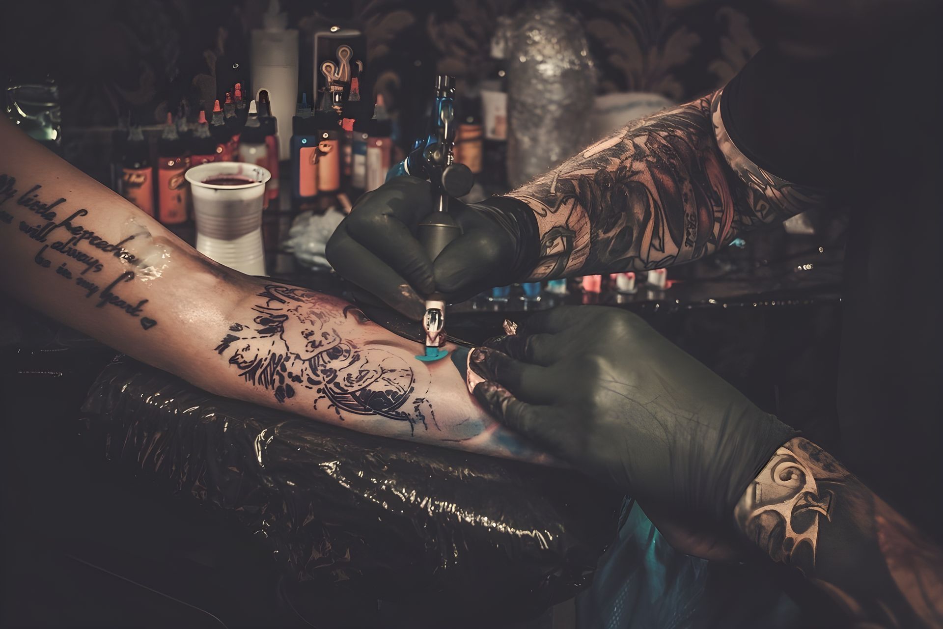 Person Getting A Tattoo On Their Arm By A Tattoo Artist, Studio Setting — Tattoo Inc Studio in Robina, QLD