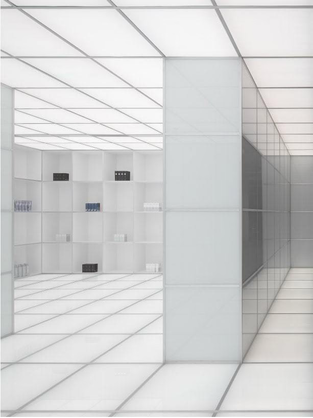 White, Minimalist Interior With Square Panels. A Partially Visible, Dark Rectangle — Tattoo Inc Studio In Broadbeach, QLD