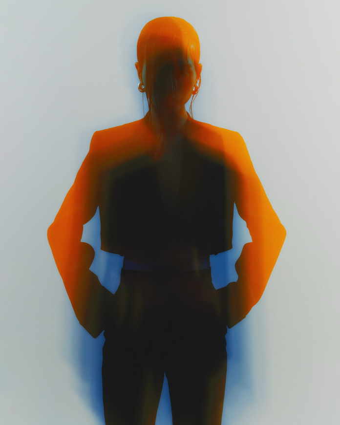 Silhouette of a Person With Hands on Hips, Wearing a Blazer — Tattoo Inc Studio In Broadbeach, QLD