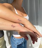 Two Arms With Small Script Tattoos Crossed — Tattoo Inc Studio In Broadbeach, QLD