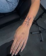 Forearm and Hand With a Black Star Tattoo, Resting — Tattoo Inc Studio In Broadbeach, QLD