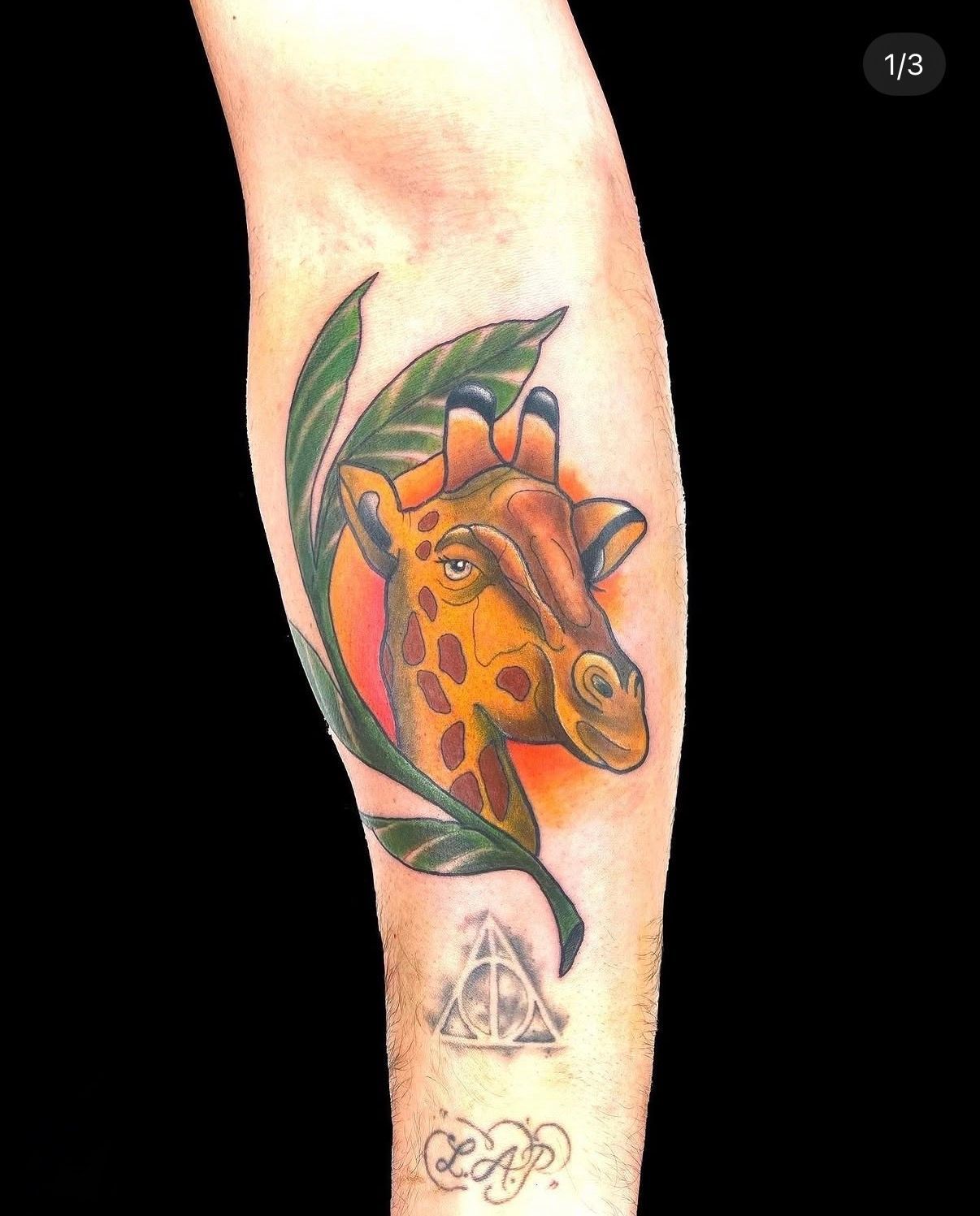 Colourful Giraffe Tattoo on a Forearm — Tattoo Inc Studio In Broadbeach, QLD