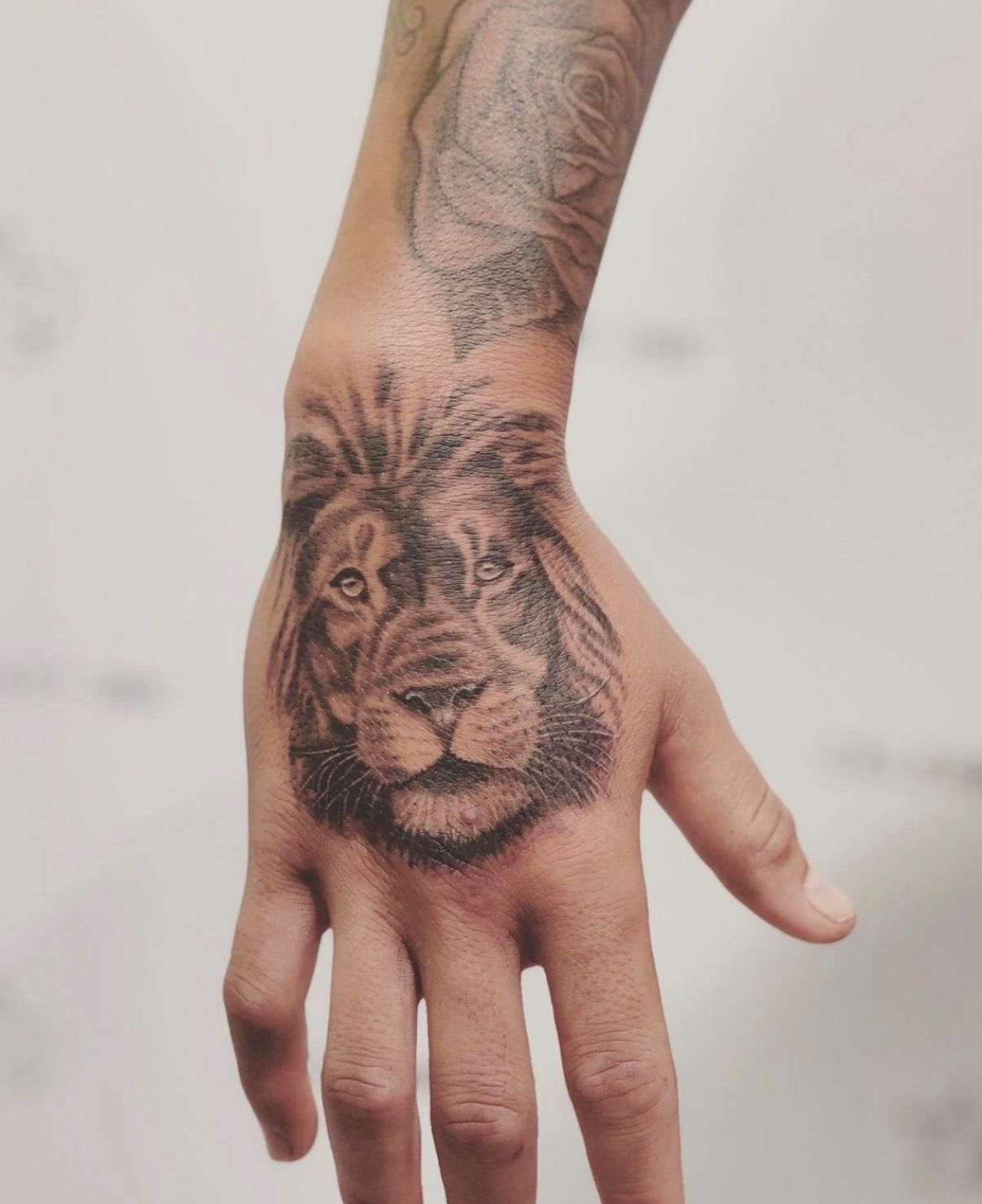 Hand With a Detailed Lion Tattoo on the Back and Forearm — Tattoo Inc Studio In Broadbeach, QLD