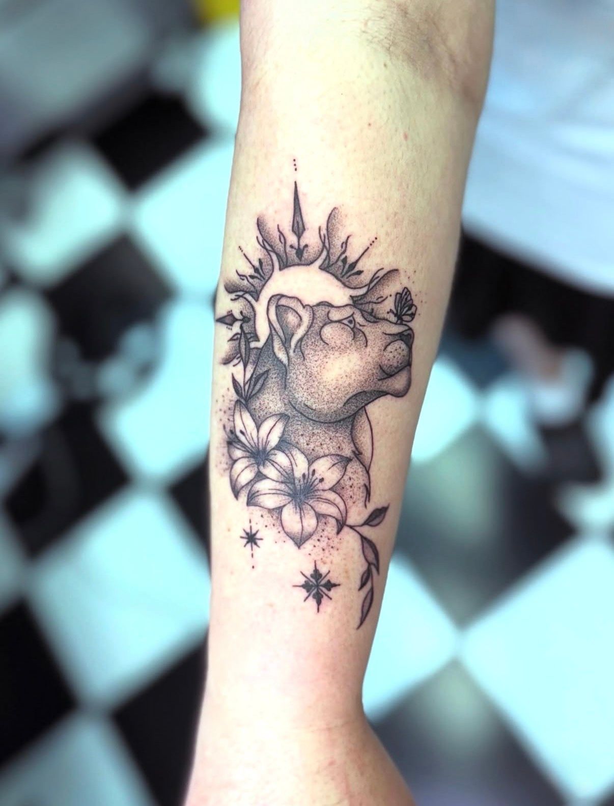 Black-and-gray Tattoo of a Skull With Flowers on a Forearm — Tattoo Inc Studio In Broadbeach, QLD