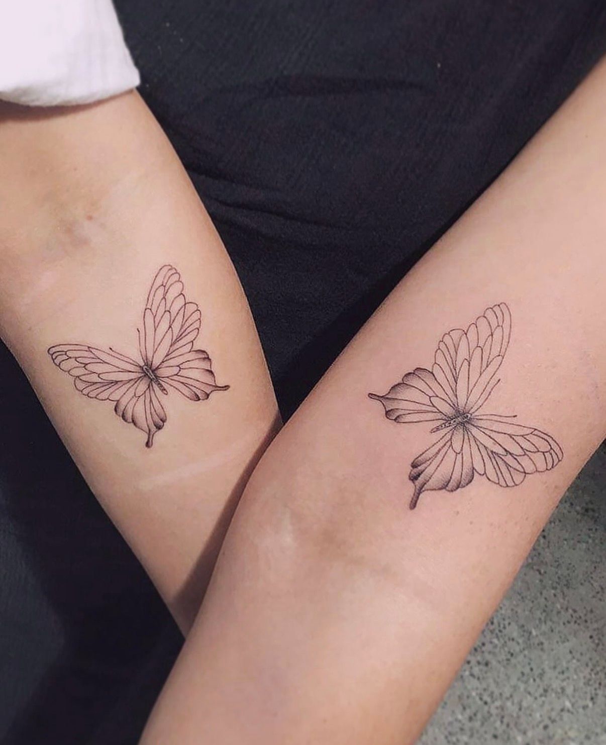 Two Forearms With Matching Black Butterfly Line-art Tattoos — Tattoo Inc Studio In Broadbeach, QLD