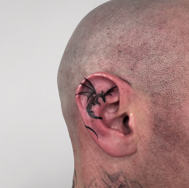 Close-up of a Shaved Ear With Black Tattoo-like Scarring — Tattoo Inc Studio In Broadbeach, QLD
