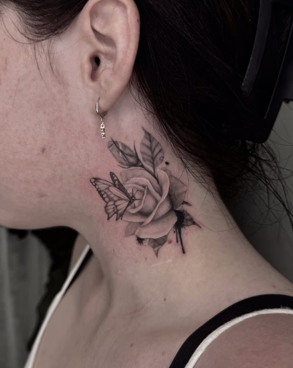 Side of Neck With a Black Rose Tattoo and Small Butterfly — Tattoo Inc Studio In Broadbeach, QLD