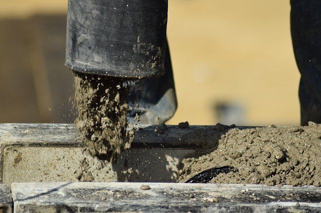 a concrete pump is used to push concrete into a fitting