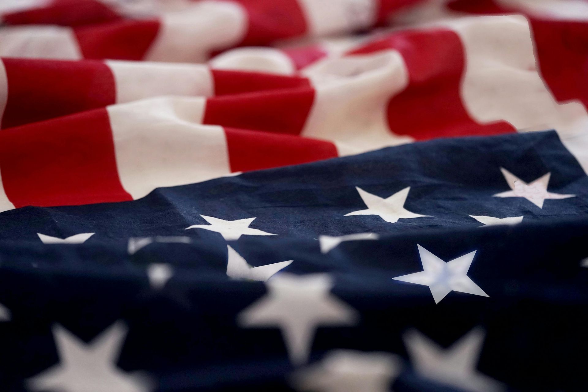 American flag with red and white stripes and blue field of stars.