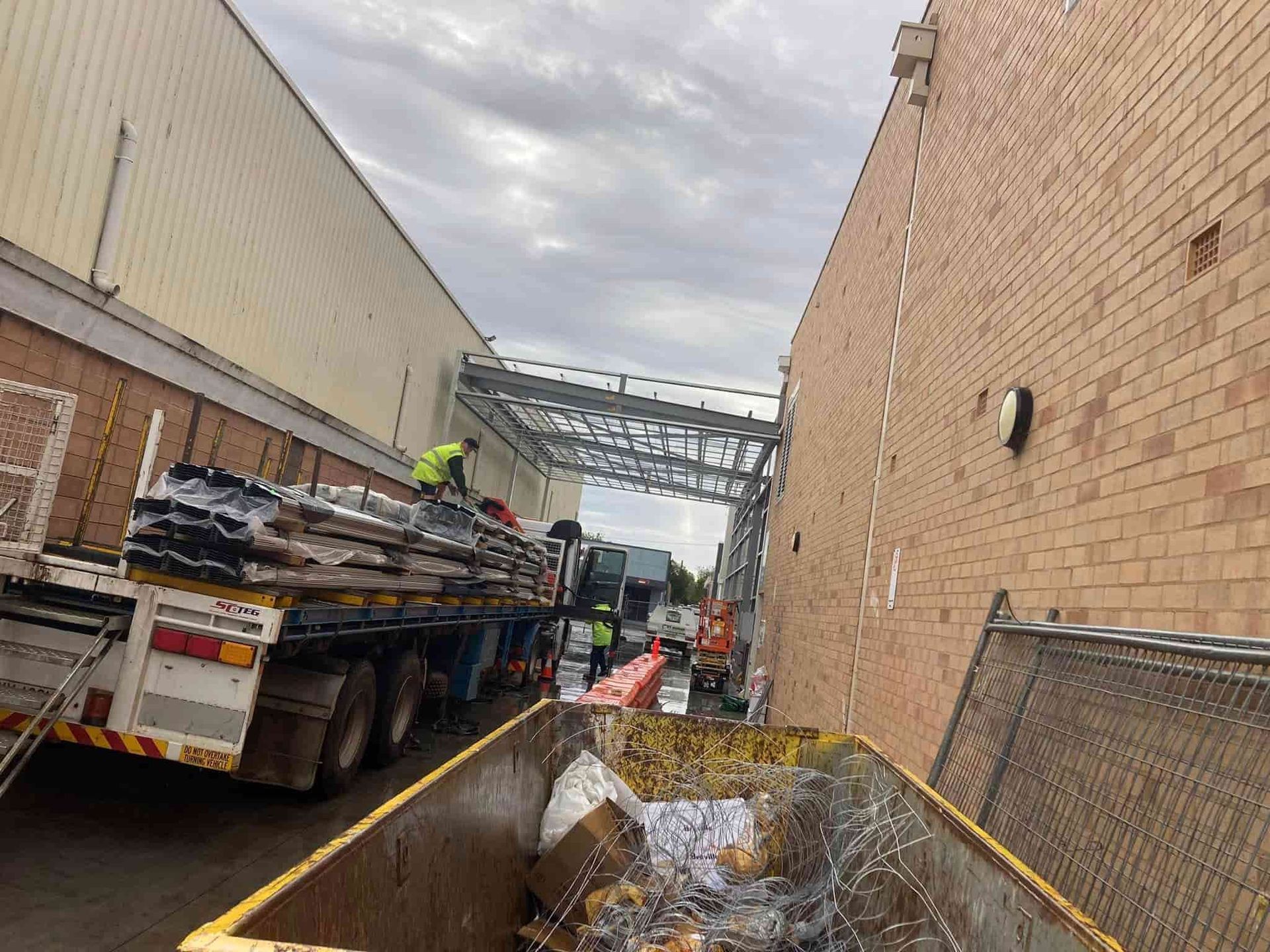 Narrow Alley With Construction Debris — SJ Moore Plumbing & Roofing in Gundagai, NSW