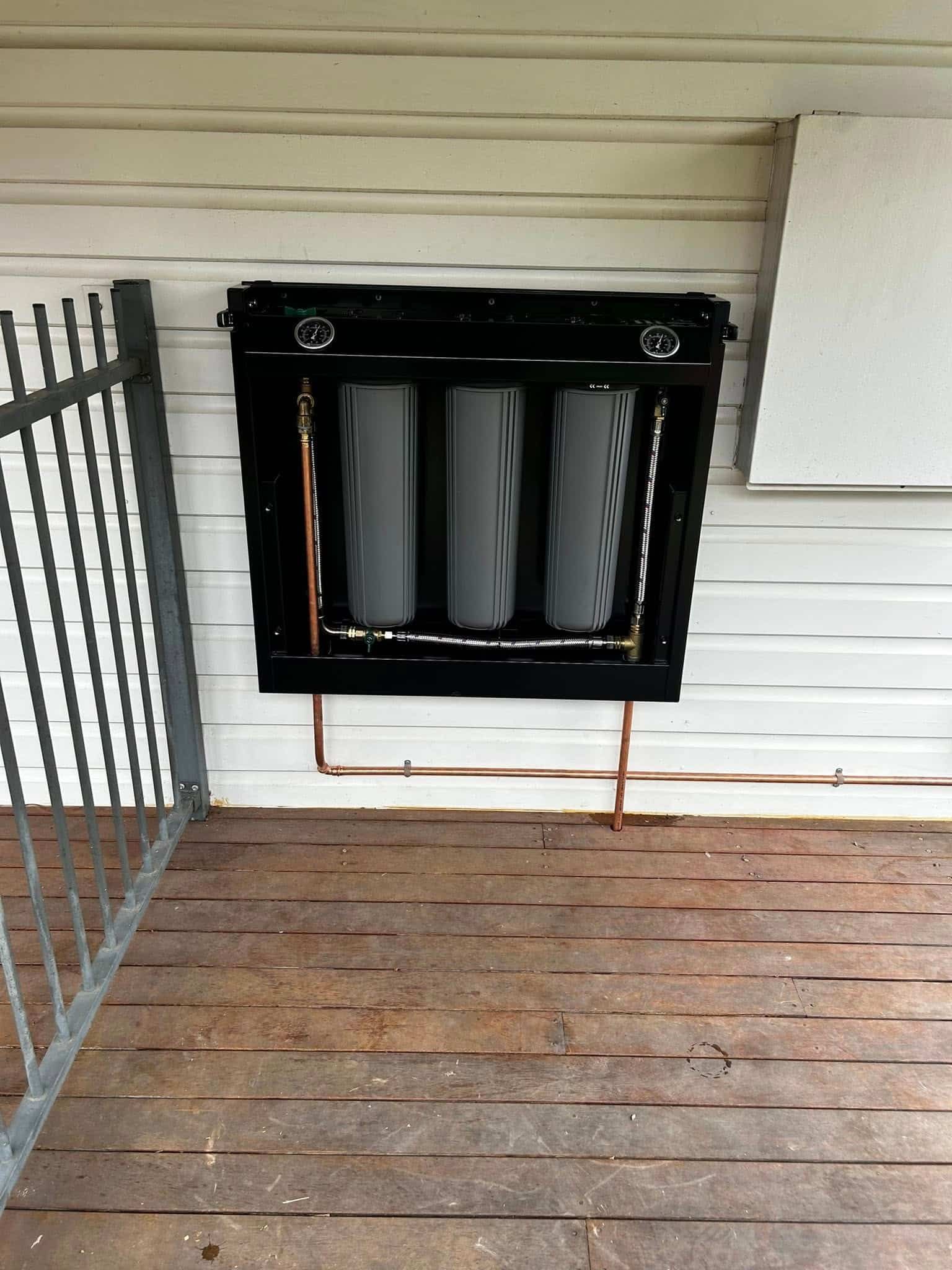 Hot Water System Attached On A House — SJ Moore Plumbing & Roofing in Wagga Wagga, NSW