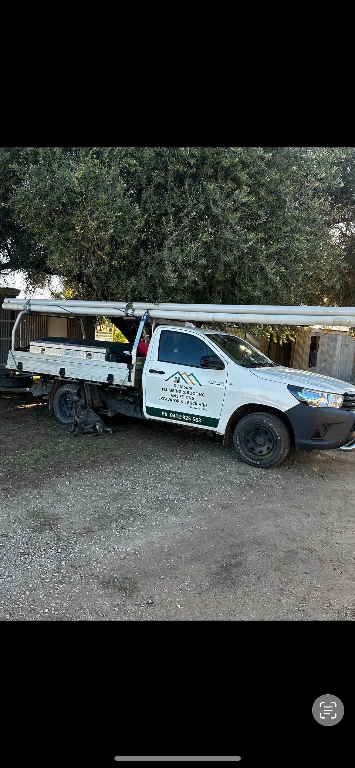 Plumbing and Gas Fitting Work Ute With Pipe Rack — SJ Moore Plumbing & Roofing in Wagga Wagga, NSW