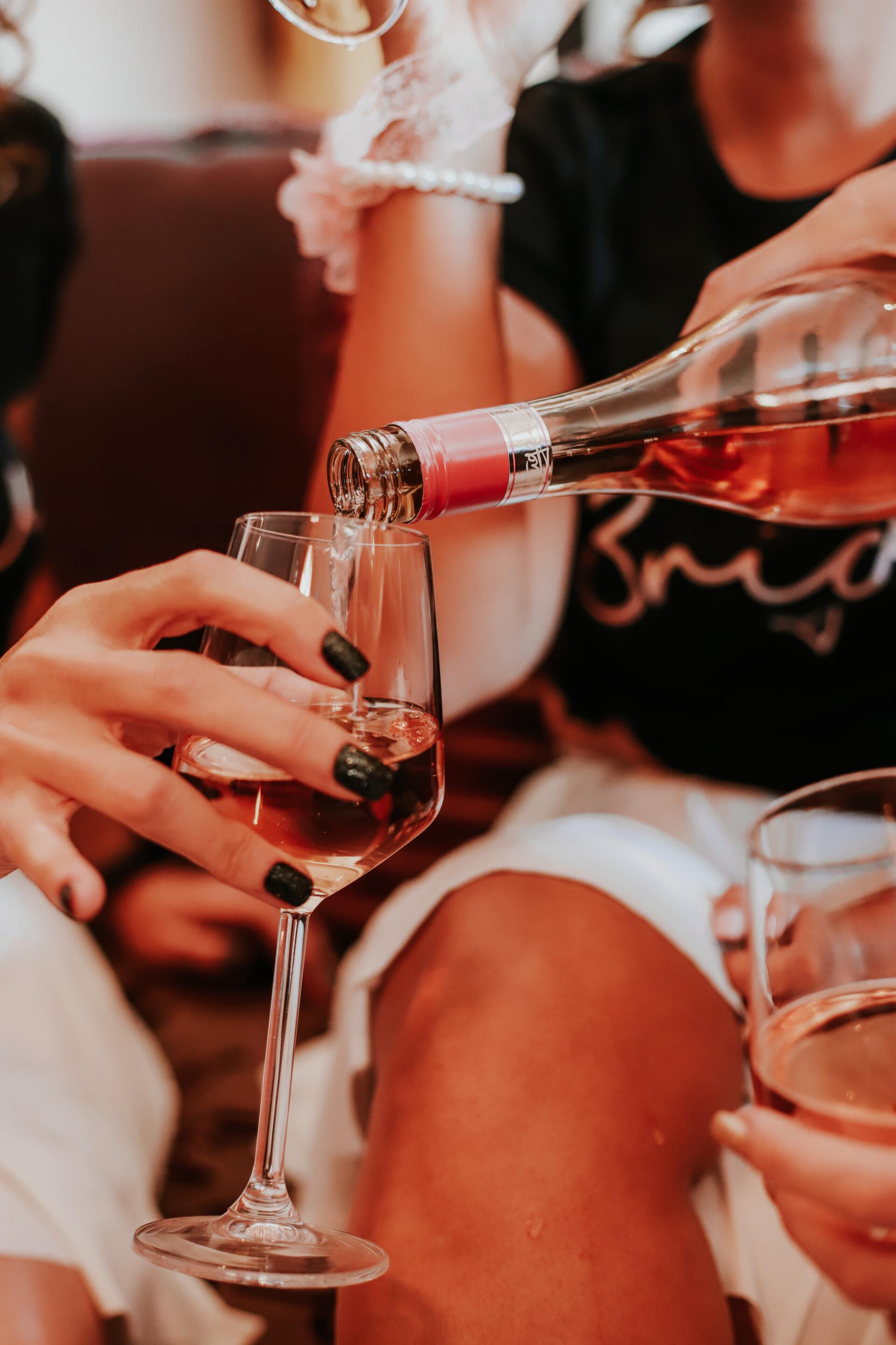 Pouring Rosé Into Glass  - Your Local Adult Store in Kempsey, NSW