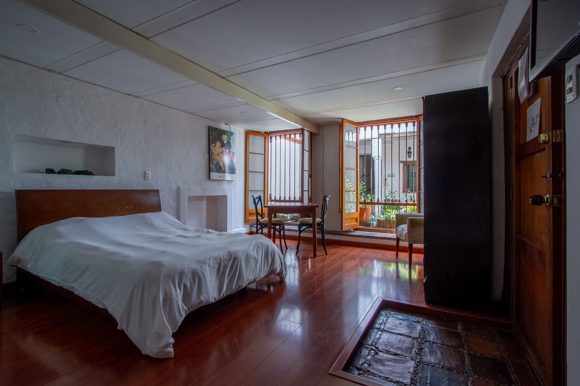 There is a large bed in the middle of the room.